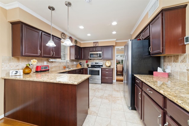 kitchen with light stone counters, visible vents, ornamental molding, a sink, and appliances with stainless steel finishes