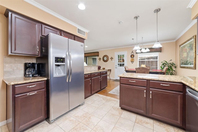 kitchen featuring tasteful backsplash, ornamental molding, visible vents, and stainless steel appliances