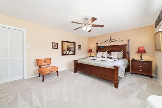 bedroom featuring light carpet, a ceiling fan, and baseboards