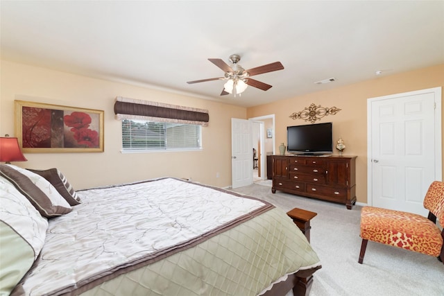 bedroom with visible vents, baseboards, a ceiling fan, and carpet floors