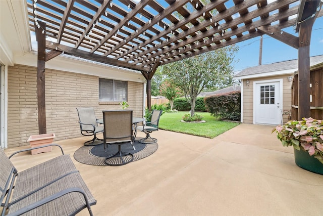 view of patio featuring outdoor dining space, fence, and a pergola