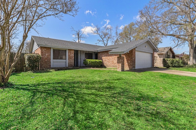 ranch-style home with concrete driveway, brick siding, a garage, and a front lawn