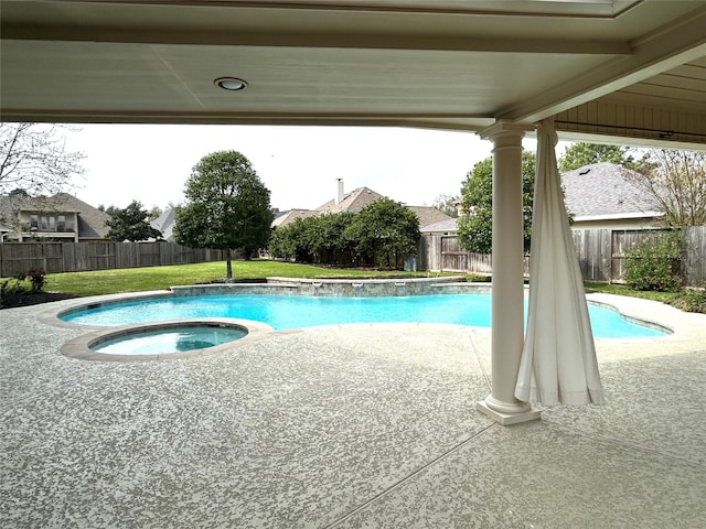 view of swimming pool with a patio, a fenced backyard, and a lawn