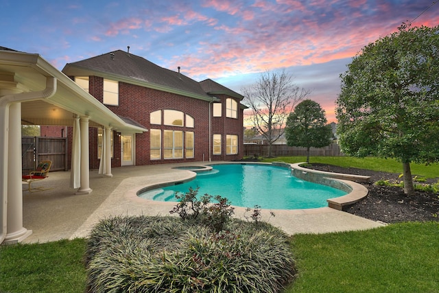 view of swimming pool with a fenced in pool, a patio area, and fence