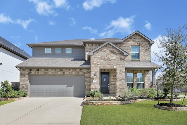 view of front of home featuring a shingled roof, concrete driveway, an attached garage, a front yard, and brick siding