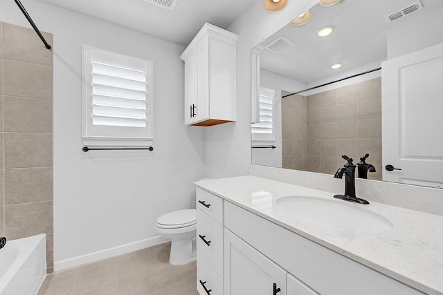 bathroom featuring vanity, baseboards, visible vents, tile patterned flooring, and toilet