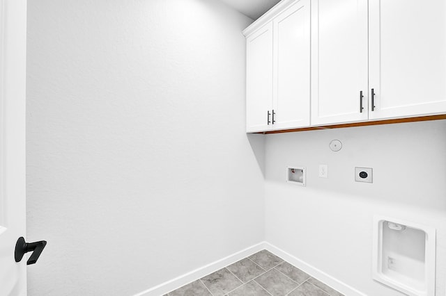 laundry room featuring hookup for a washing machine, baseboards, cabinet space, electric dryer hookup, and hookup for a gas dryer