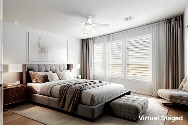 bedroom with a ceiling fan, visible vents, and light wood-type flooring