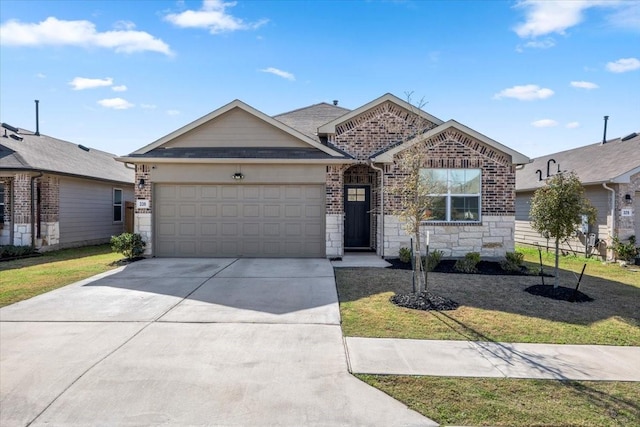 ranch-style house featuring a front yard, concrete driveway, a garage, stone siding, and brick siding