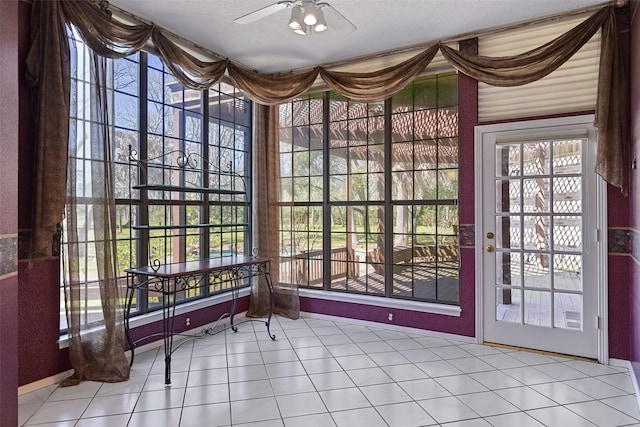 interior space with ceiling fan