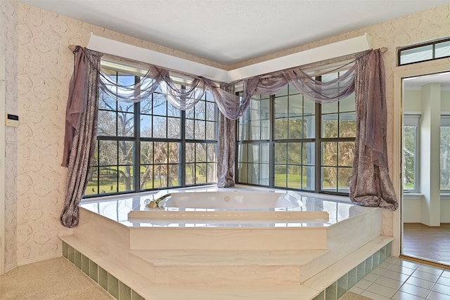 bathroom featuring baseboards, a garden tub, and wallpapered walls