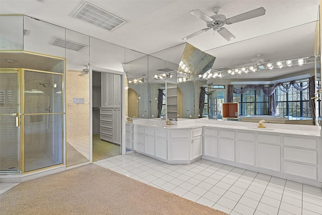 full bathroom with tile patterned floors, a ceiling fan, visible vents, and a shower stall