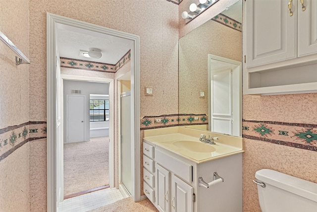 bathroom with vanity, visible vents, wallpapered walls, a textured ceiling, and toilet