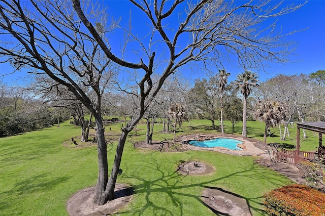 view of home's community featuring a lawn