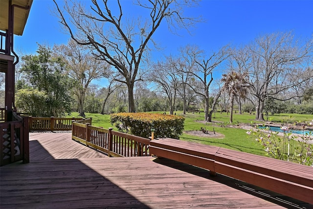 wooden terrace with a yard