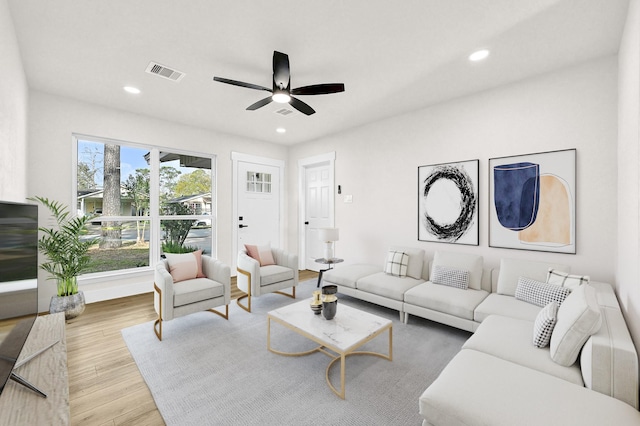 living area featuring recessed lighting, visible vents, wood finished floors, and a ceiling fan