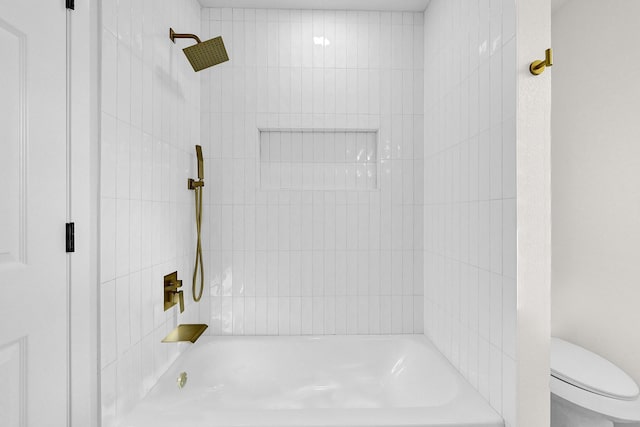 bathroom featuring toilet and shower / bathtub combination