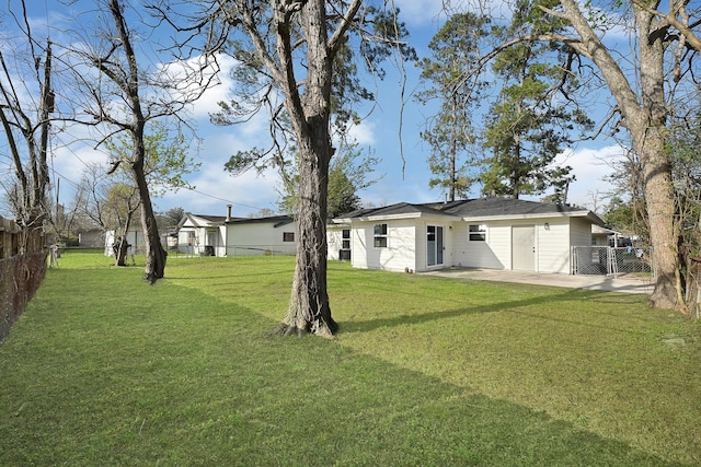 exterior space with a patio area and a fenced backyard