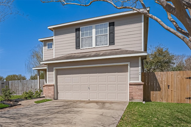 traditional-style home with a garage, brick siding, concrete driveway, and fence