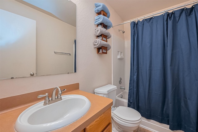 full bathroom with shower / bath combination with curtain, toilet, and vanity