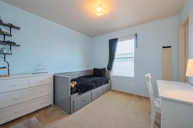 bedroom featuring light colored carpet