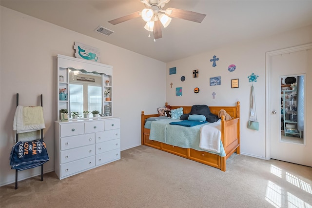 bedroom with visible vents, carpet floors, and ceiling fan