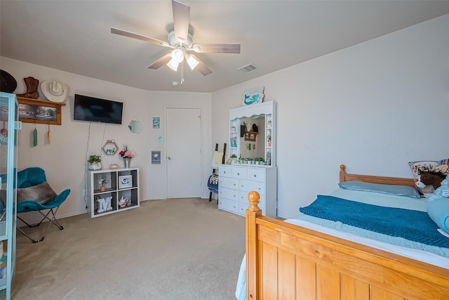 bedroom featuring ceiling fan, visible vents, and light carpet