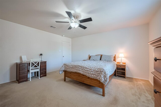 bedroom featuring visible vents, ceiling fan, and carpet floors