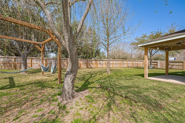 view of yard with a fenced backyard and a patio area