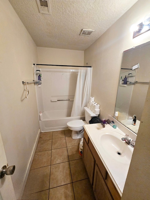 full bathroom with vanity, visible vents, shower / bath combo, tile patterned flooring, and toilet