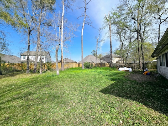 view of yard with a fenced backyard