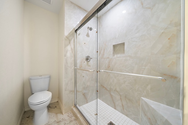 full bath with toilet, baseboards, marble finish floor, and a stall shower