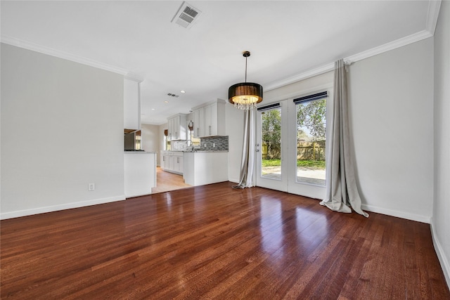 unfurnished living room with visible vents, baseboards, crown molding, and light wood finished floors