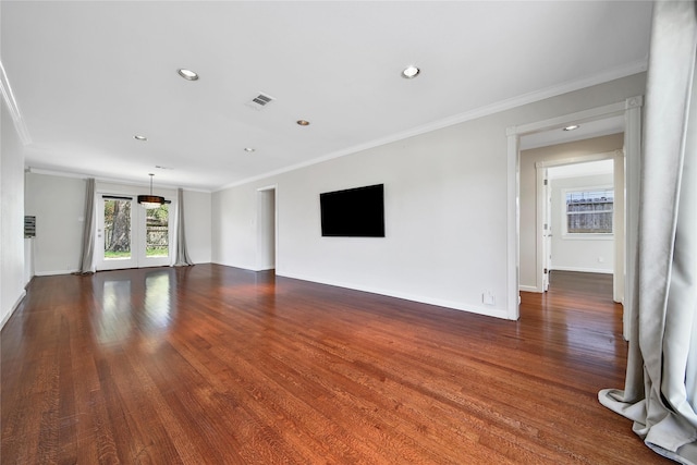 unfurnished living room featuring visible vents, crown molding, and dark wood-style flooring