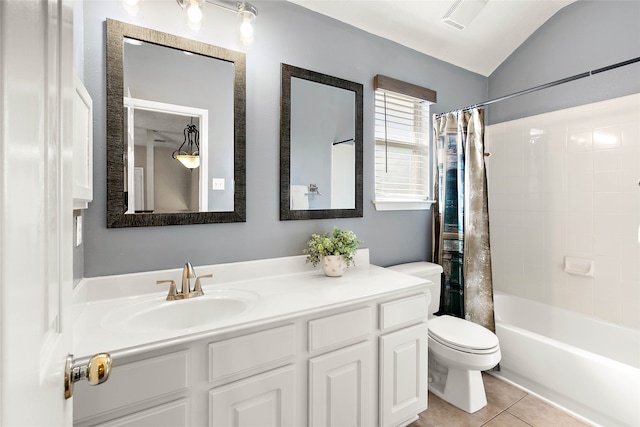 full bathroom featuring tile patterned flooring, visible vents, toilet, lofted ceiling, and vanity