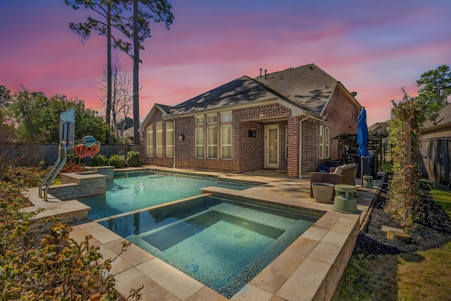 view of pool featuring a fenced in pool, a patio, an in ground hot tub, and a fenced backyard