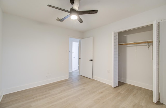 unfurnished bedroom featuring visible vents, light wood-type flooring, and baseboards