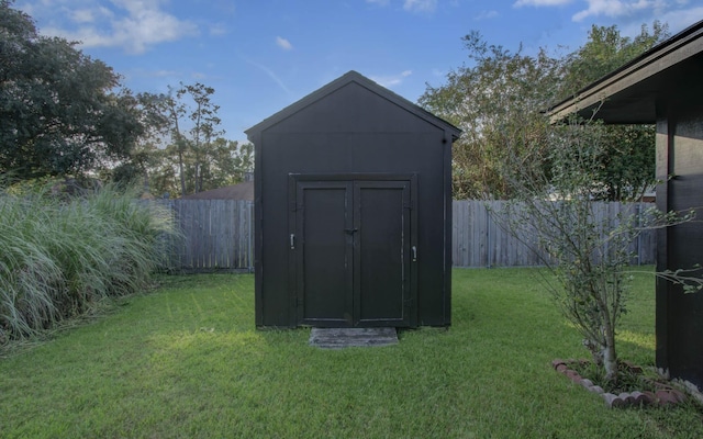 view of shed with a fenced backyard