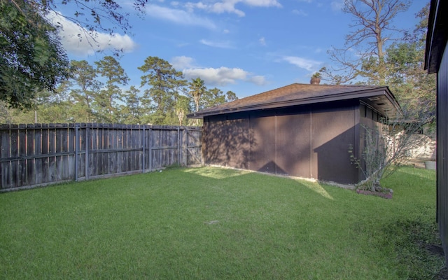 view of yard with a fenced backyard