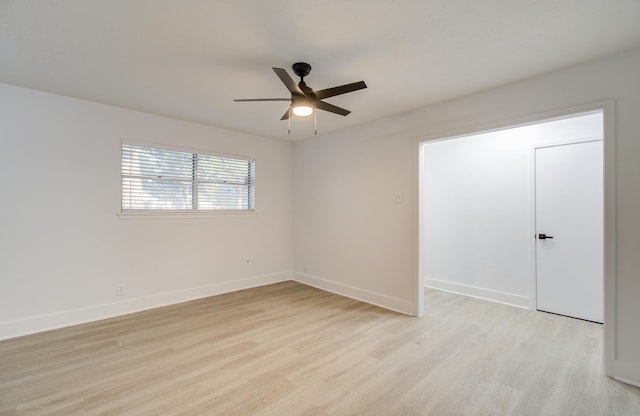 unfurnished bedroom featuring baseboards, light wood-style floors, and a ceiling fan