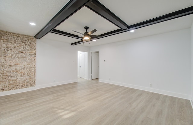 spare room featuring light wood finished floors, baseboards, ceiling fan, beam ceiling, and recessed lighting