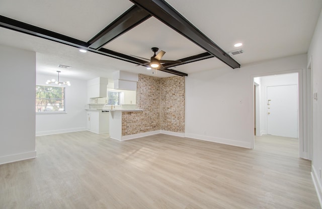 unfurnished living room with visible vents, baseboards, light wood-type flooring, beam ceiling, and ceiling fan with notable chandelier