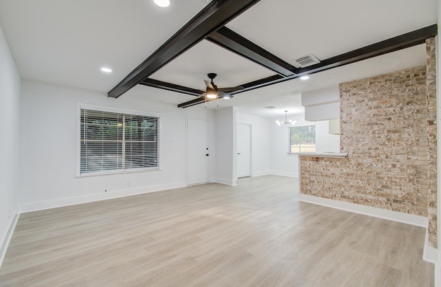 unfurnished living room featuring beam ceiling, light wood-style flooring, and visible vents