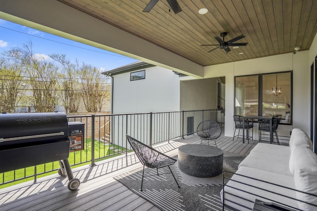 wooden deck with an outdoor living space, a grill, and ceiling fan