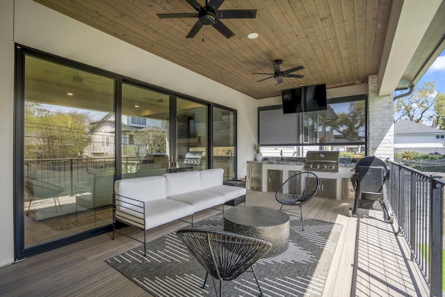 wooden deck with outdoor lounge area, area for grilling, a ceiling fan, and a grill