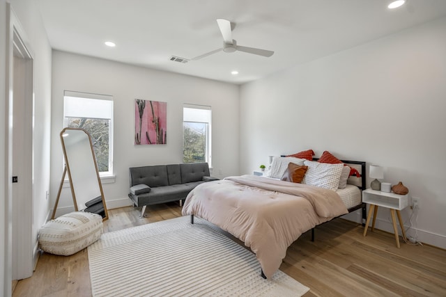 bedroom with baseboards, visible vents, recessed lighting, ceiling fan, and light wood-type flooring