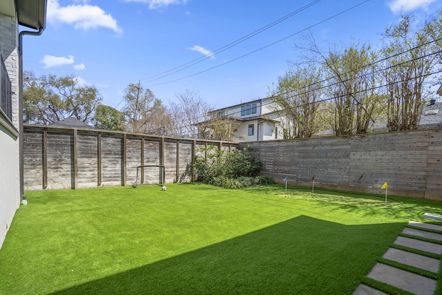 view of yard featuring a fenced backyard