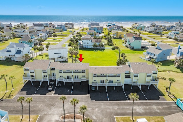 birds eye view of property with a water view and a residential view