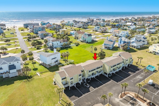 drone / aerial view with a residential view and a water view