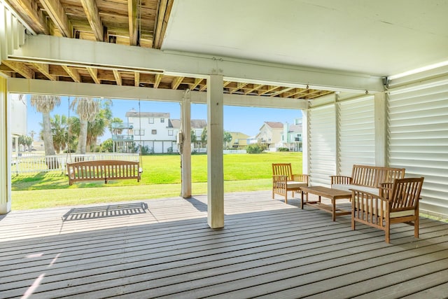 wooden deck featuring a residential view, a yard, and fence